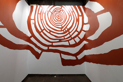 red labyrinth covering three white walls
